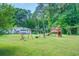 Large backyard with playset, providing ample space for children at 500 Cochran Rd, Covington, GA 30014