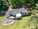 Aerial view of the house, deck, and inground pool at 500 Cochran Rd, Covington, GA 30014