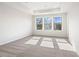 Spacious bedroom with neutral carpeting and ample natural light at 2727 Harrison Dr, Lawrenceville, GA 30044