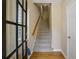 Bright entryway with hardwood floors and staircase leading to upper level at 4740 Legacy Cove Ln, Mableton, GA 30126