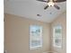 Bright bedroom with two windows and ceiling fan at 4740 Legacy Cove Ln, Mableton, GA 30126