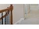 Upper hallway with wood railing and carpeted flooring at 4740 Legacy Cove Ln, Mableton, GA 30126