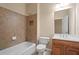 Basement bathroom with tub, toilet, and vanity at 4740 Legacy Cove Ln, Mableton, GA 30126