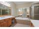 Elegant bathroom with a large soaking tub and double vanity at 4740 Legacy Cove Ln, Mableton, GA 30126