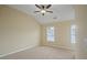 Simple bedroom with two windows and ceiling fan at 4740 Legacy Cove Ln, Mableton, GA 30126
