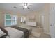Bright bedroom with large windows, offering views and access to other rooms at 4740 Legacy Cove Ln, Mableton, GA 30126