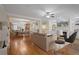 Open concept main living area with hardwood floors, and built-in shelving at 4740 Legacy Cove Ln, Mableton, GA 30126