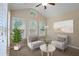 Relaxing sunroom with two armchairs and plenty of natural light at 4740 Legacy Cove Ln, Mableton, GA 30126