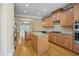 Open kitchen with island and stainless steel appliances at 4740 Legacy Cove Ln, Mableton, GA 30126