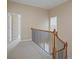 Upstairs hallway with access to bedrooms and stairs at 4740 Legacy Cove Ln, Mableton, GA 30126