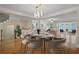 Open concept dining room with hardwood floors, and access to living room at 4740 Legacy Cove Ln, Mableton, GA 30126