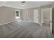 Bright bedroom with window, carpet flooring, and access to upstairs hallway at 421 Thornbush Trce, Lawrenceville, GA 30046