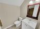 Clean bathroom with toilet, sink, and vanity with mirror at 421 Thornbush Trce, Lawrenceville, GA 30046
