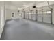 Large garage with two automatic doors and light gray epoxy floor at 421 Thornbush Trce, Lawrenceville, GA 30046