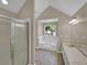 Bathroom with soaking tub, double vanity, and shower at 421 Thornbush Trce, Lawrenceville, GA 30046