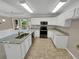 Updated kitchen with granite countertops and stainless steel appliances at 421 Thornbush Trce, Lawrenceville, GA 30046