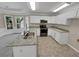 Eat-in kitchen with granite counters and stainless steel appliances at 421 Thornbush Trce, Lawrenceville, GA 30046