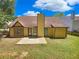 House back view, patio, and grassy yard at 421 Thornbush Trce, Lawrenceville, GA 30046