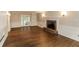 Spacious living room with hardwood floors, a fireplace, and built-in shelves at 2848 Creekwood Dr, Snellville, GA 30078