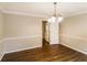 Simple dining room with hardwood floors and access to kitchen at 2848 Creekwood Dr, Snellville, GA 30078