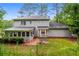 Two-story home with a screened porch and backyard patio at 2848 Creekwood Dr, Snellville, GA 30078