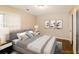 Spacious bedroom with a large bed, nightstands, and artwork at 2848 Creekwood Dr, Snellville, GA 30078