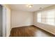Well-lit bedroom with wood-look floors and a large closet at 2848 Creekwood Dr, Snellville, GA 30078