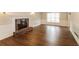 Living room with hardwood floors, fireplace, and white wainscoting at 2848 Creekwood Dr, Snellville, GA 30078