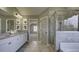 Elegant bathroom with granite countertops, double sinks, and a large walk-in shower at 557 Saltbox Ln, Mcdonough, GA 30252