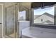 Spa-like bathroom with a soaking tub and a walk-in shower at 557 Saltbox Ln, Mcdonough, GA 30252