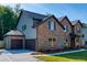 Two-story home with brick and siding, two-car garage, and landscaped yard at 557 Saltbox Ln, Mcdonough, GA 30252