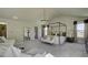 Main bedroom with a four poster bed, seating area and large windows at 557 Saltbox Ln, Mcdonough, GA 30252
