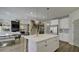 Open kitchen with large island, stainless steel appliances, and views to living areas at 557 Saltbox Ln, Mcdonough, GA 30252