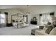 Main bedroom with a four poster bed, seating area and large windows at 557 Saltbox Ln, Mcdonough, GA 30252