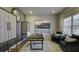 Home office with built-in shelving, large art piece, and comfortable seating at 557 Saltbox Ln, Mcdonough, GA 30252