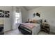Bedroom with metal bed frame, nightstand, and football themed decor at 557 Saltbox Ln, Mcdonough, GA 30252