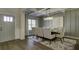 Formal dining room with chandelier, hardwood floors, and large art piece at 557 Saltbox Ln, Mcdonough, GA 30252