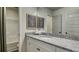 Bathroom with granite countertop, white cabinets, and shower/tub combo at 557 Saltbox Ln, Mcdonough, GA 30252