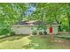 Cozy ranch home with gray brick exterior and red door at 1743 Hollyhock Ter, Decatur, GA 30032