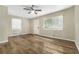 Living room with light walls, wood-look floors, and ceiling fan at 1743 Hollyhock Ter, Decatur, GA 30032