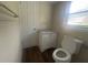 Clean bathroom with single vanity, toilet, and window at 1870 Glen Echo Dr, Decatur, GA 30032