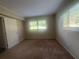 Simple bedroom with neutral walls and carpet at 1870 Glen Echo Dr, Decatur, GA 30032