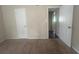 Well-lit bedroom with two closets and access to hallway at 1870 Glen Echo Dr, Decatur, GA 30032