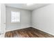 Simple bedroom with wood-look floors and neutral walls at 2069 Chicago Nw Ave, Atlanta, GA 30314