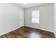 Well-lit bedroom with hardwood floors and neutral walls at 2069 Chicago Nw Ave, Atlanta, GA 30314
