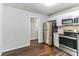 Eat-in kitchen with stainless steel appliances and wood flooring at 2069 Chicago Nw Ave, Atlanta, GA 30314