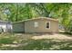 Tan brick house with green accents and a grassy yard at 2069 Chicago Nw Ave, Atlanta, GA 30314