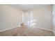 Bedroom with neutral walls and carpet, and access to a closet at 2519 Brentwood Rd, Decatur, GA 30032