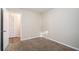 Bedroom with neutral walls, carpet, and a door to a closet at 2519 Brentwood Rd, Decatur, GA 30032