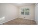 Well-lit bedroom featuring neutral walls and carpet at 2519 Brentwood Rd, Decatur, GA 30032